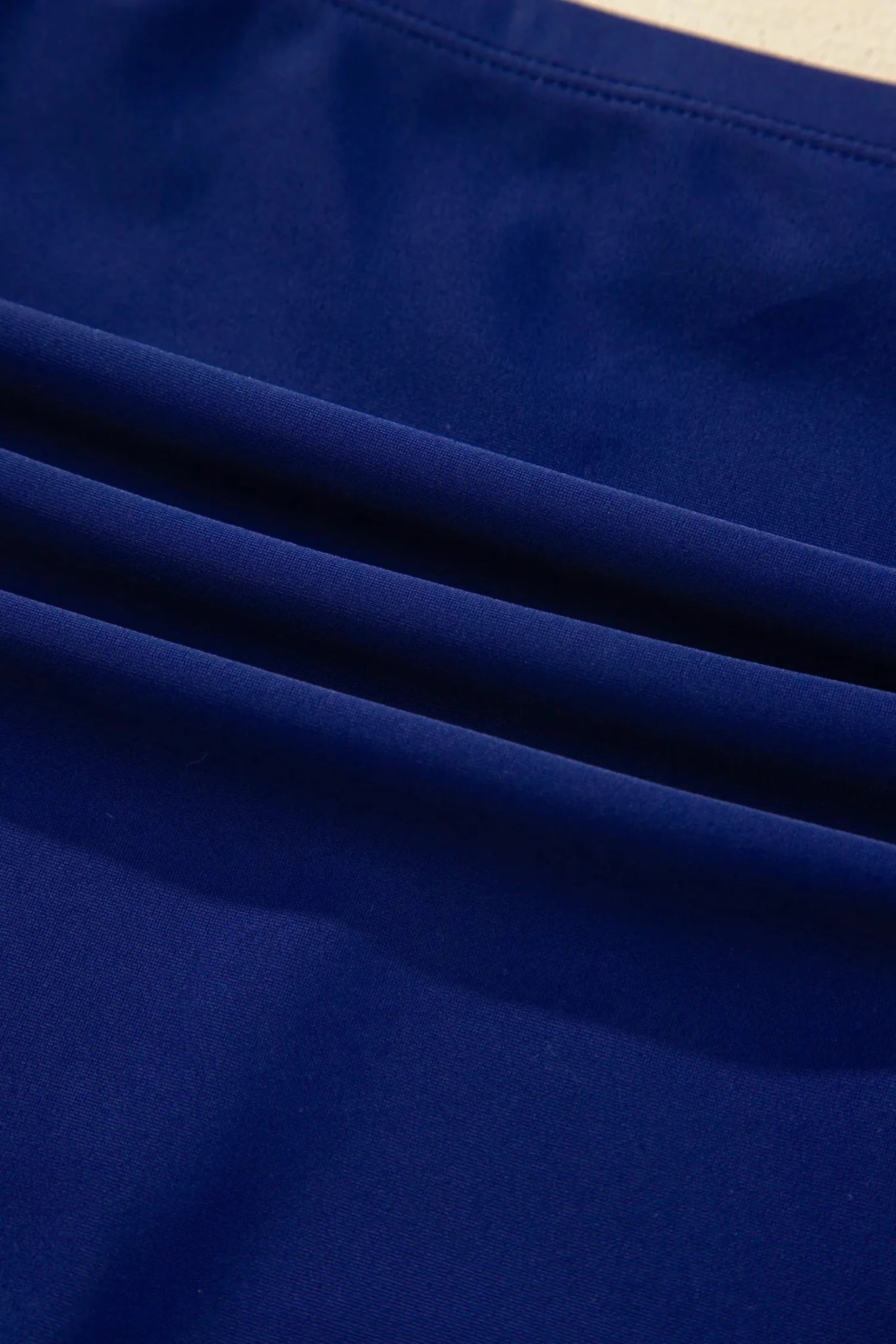 Close-up of blue fabric with folds