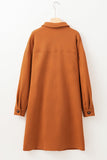 Brown coat on a hanger against a white background