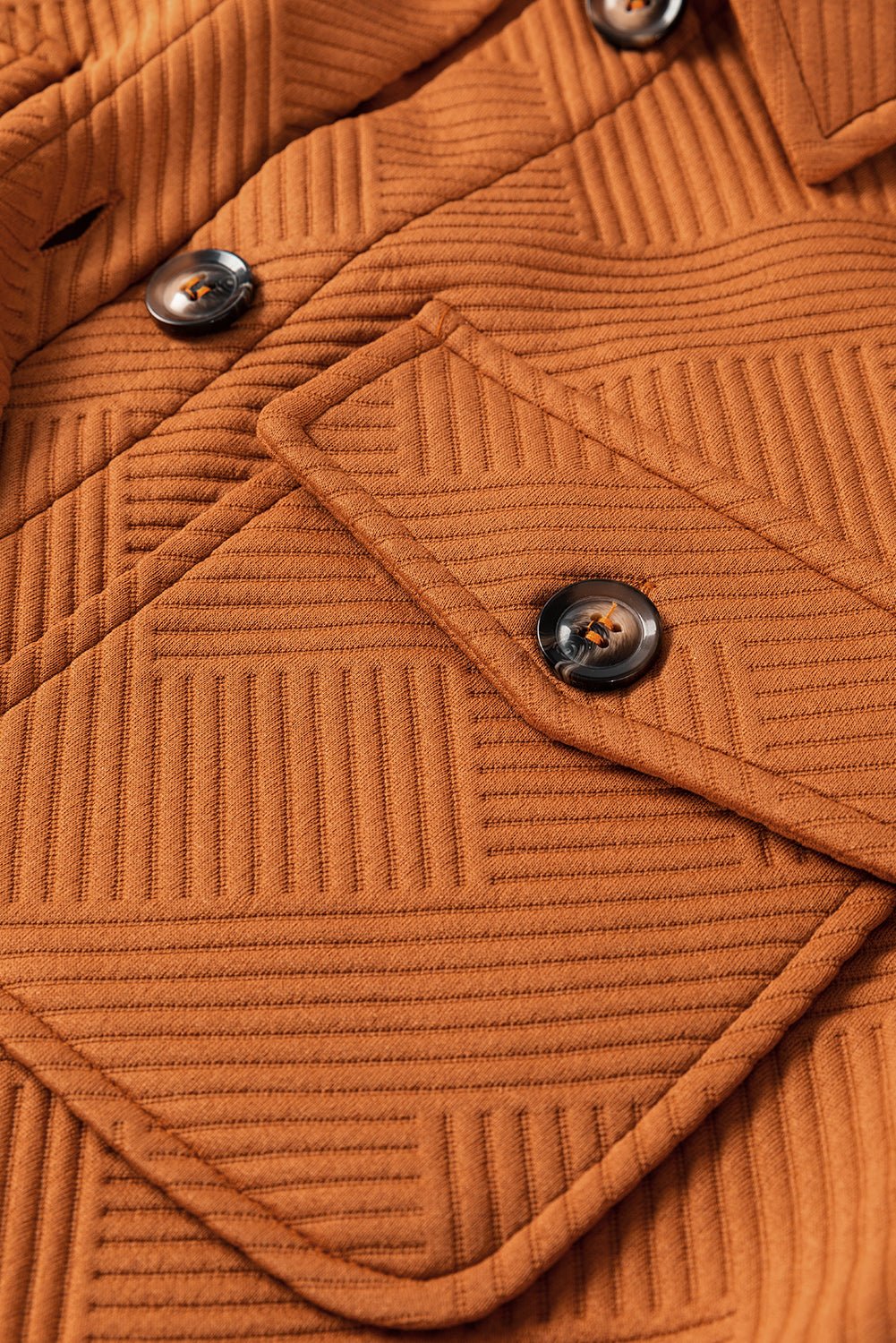 Close-up of a brown textured coat with buttons