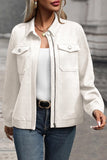 Woman in textured off-white zip jacket, white top, and blue jeans.
