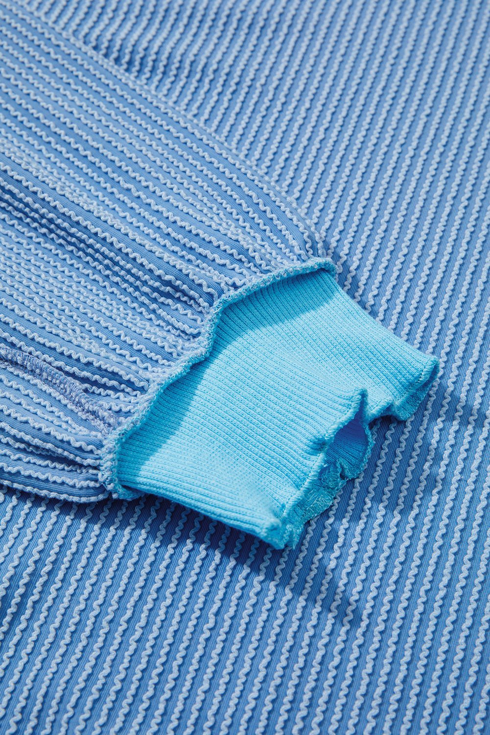 Close-up of blue fabric with a textured pattern