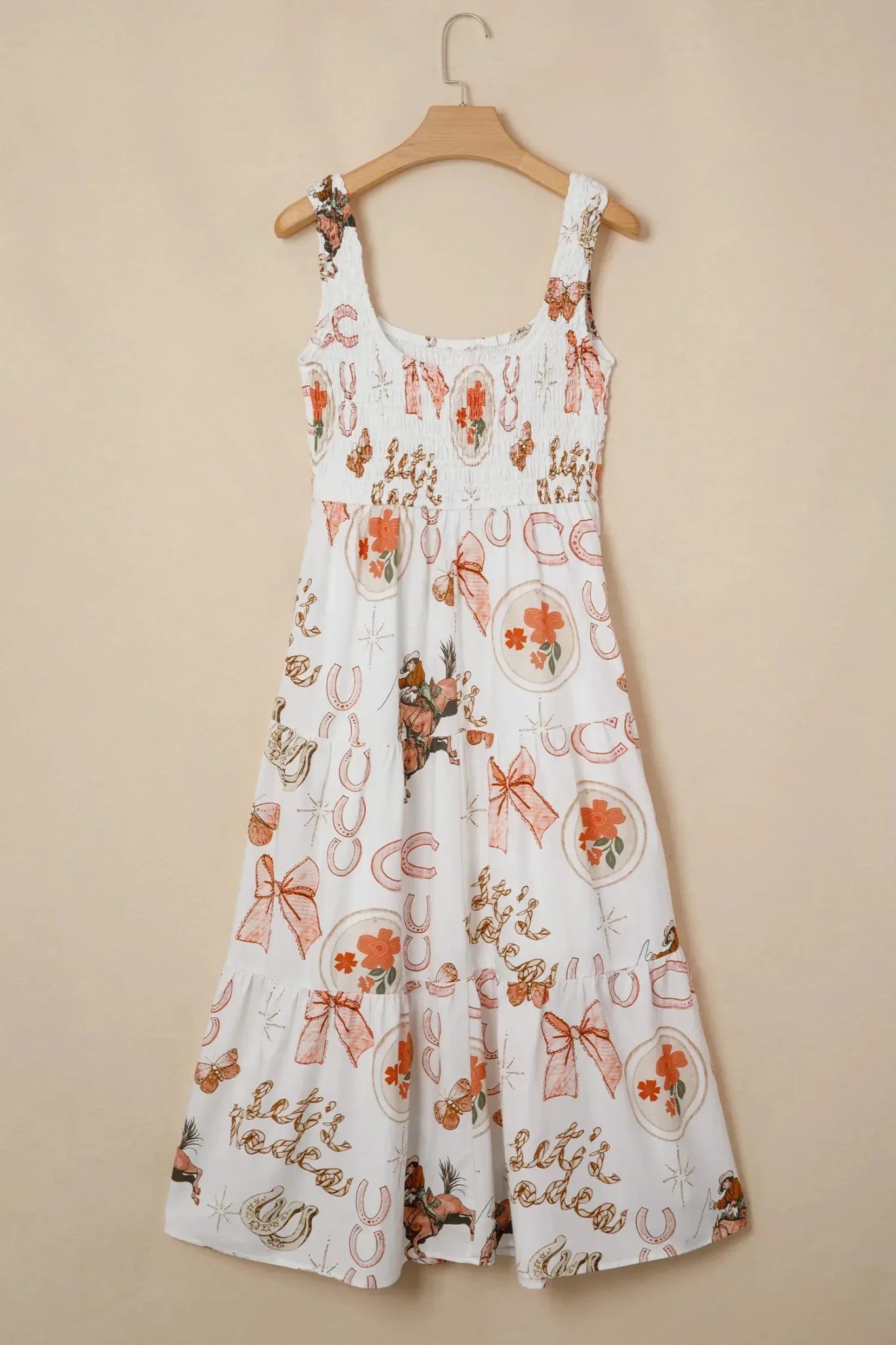 White dress with floral and ribbon pattern on a beige background