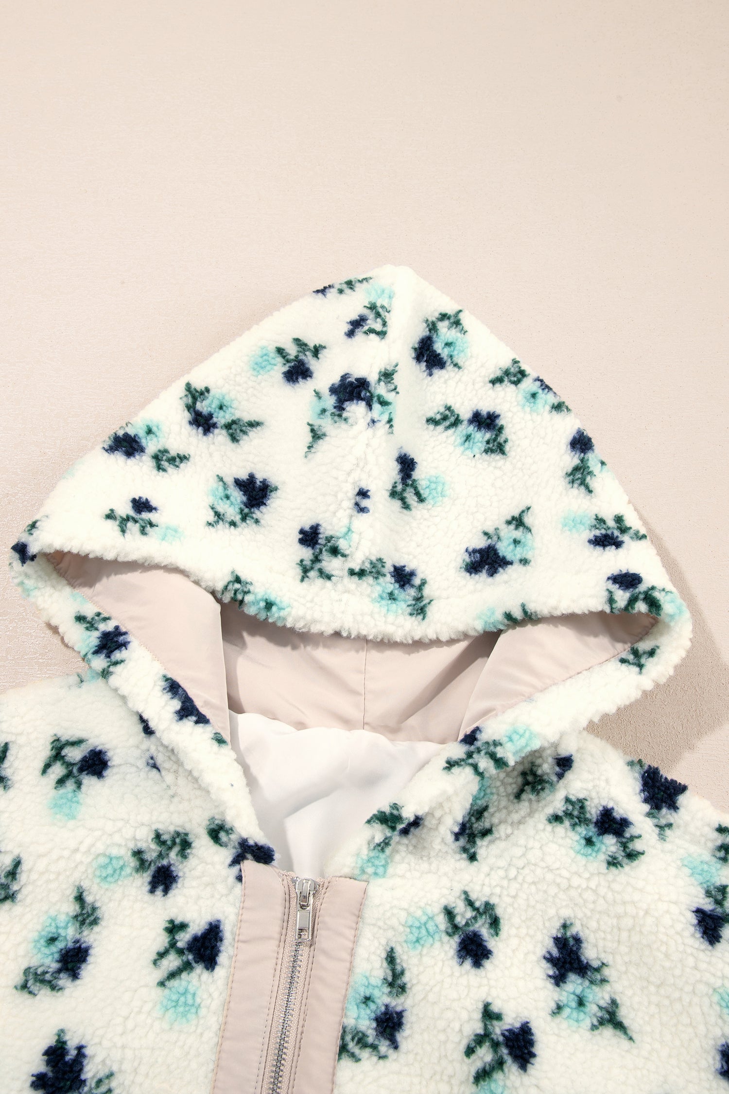 Floral sherpa hood and metal zip front detail