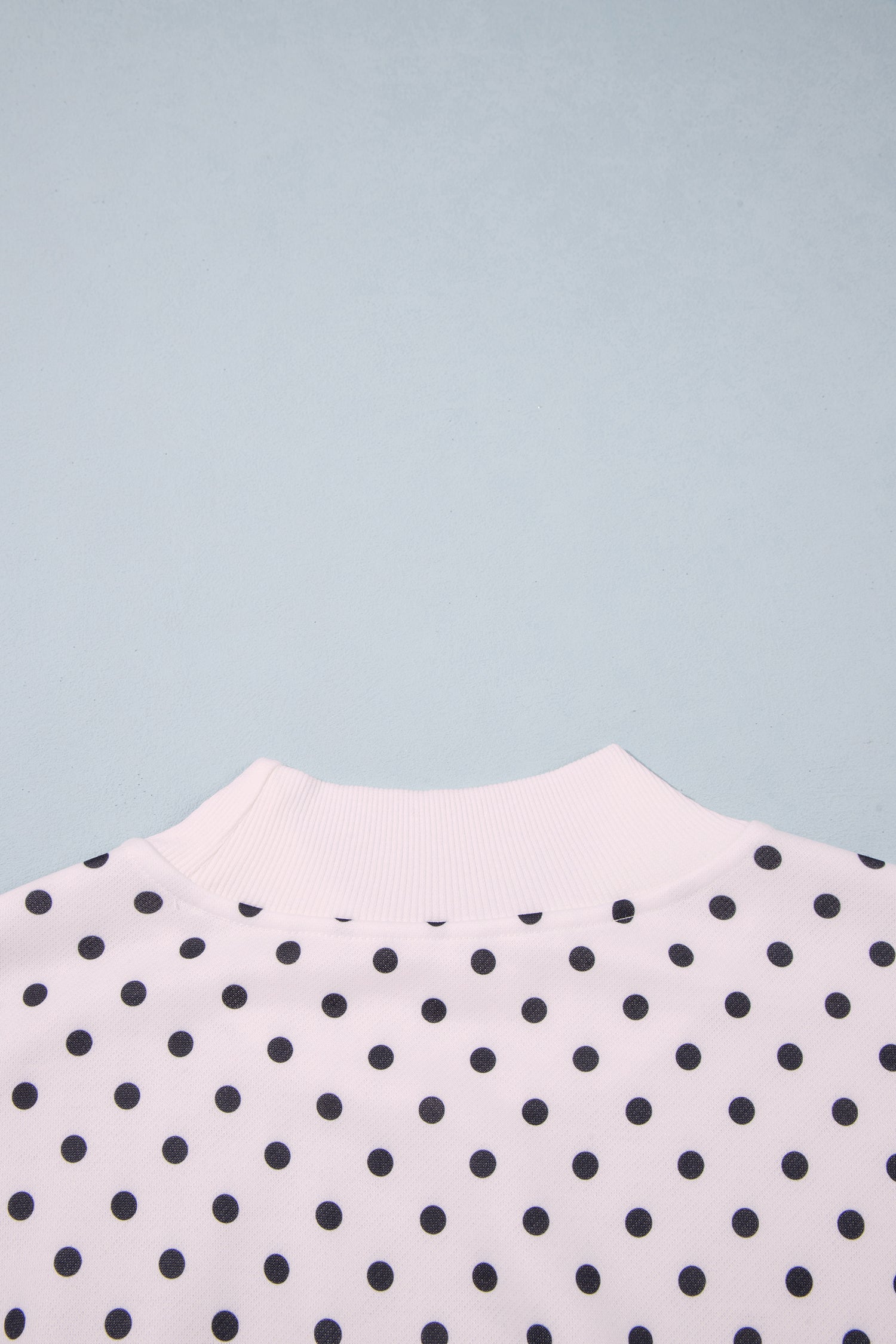 Back mock neck detail on white polka dot sweatshirt
