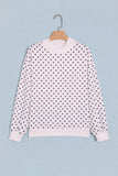 White polka dot mock neck sweatshirt on hanger, front view
