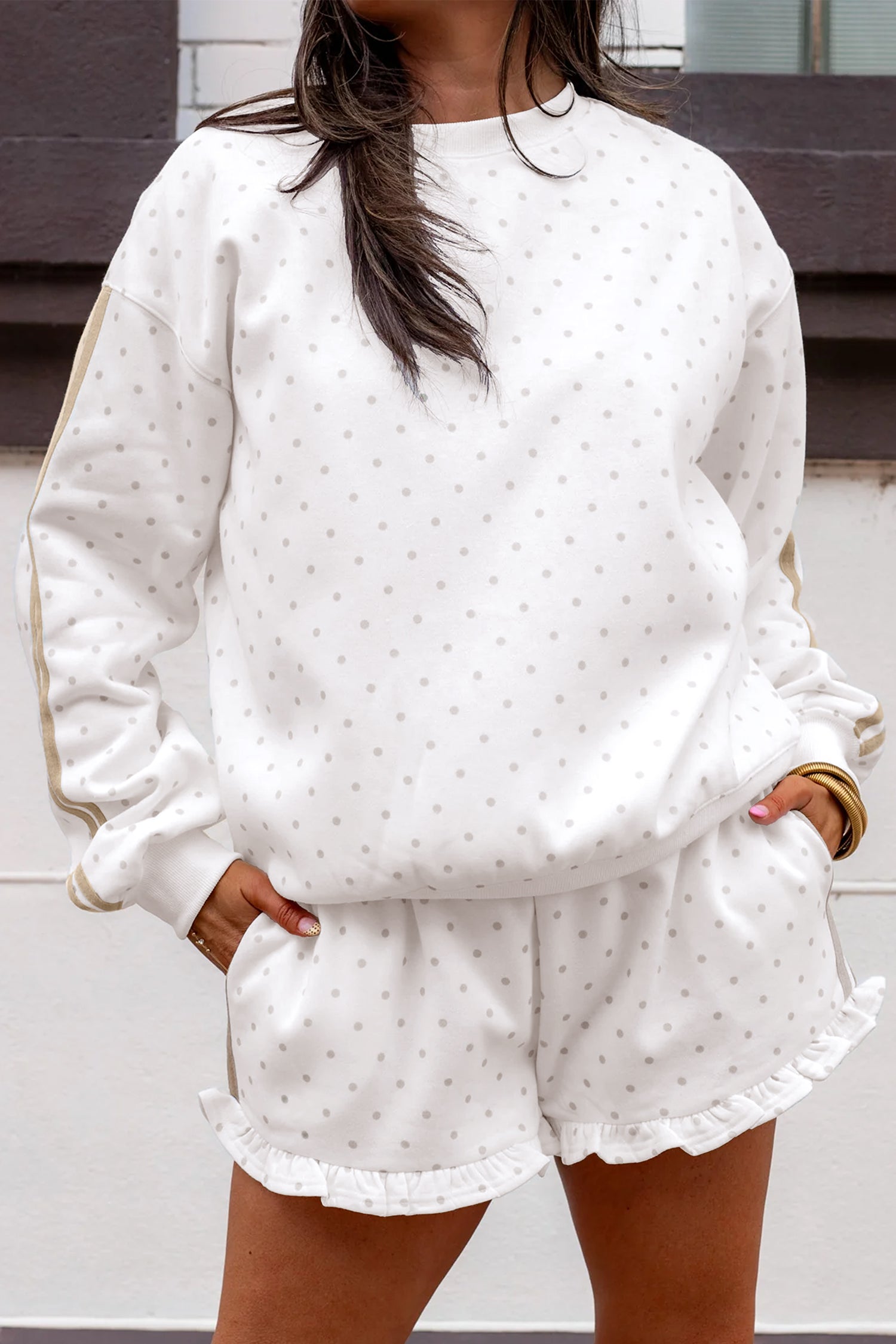 White polka dot side stripe sweatshirt and ruffle shorts set, front view on model
