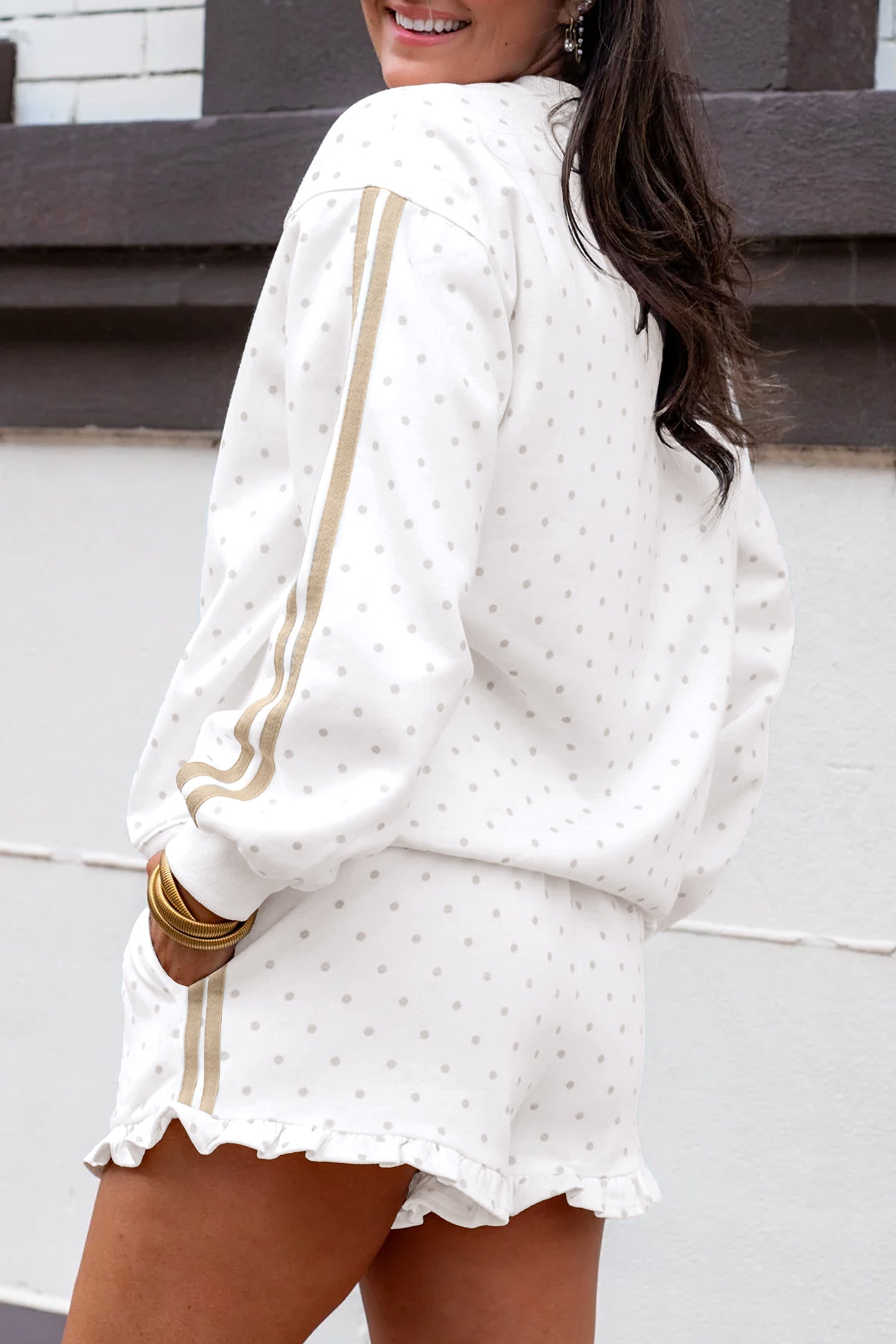 White polka dot set, side view showing beige sleeve and shorts stripes