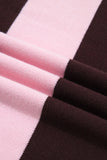 A close-up of a knit fabric with wide alternating stripes of light pink and very dark brown, shown with soft folds.
