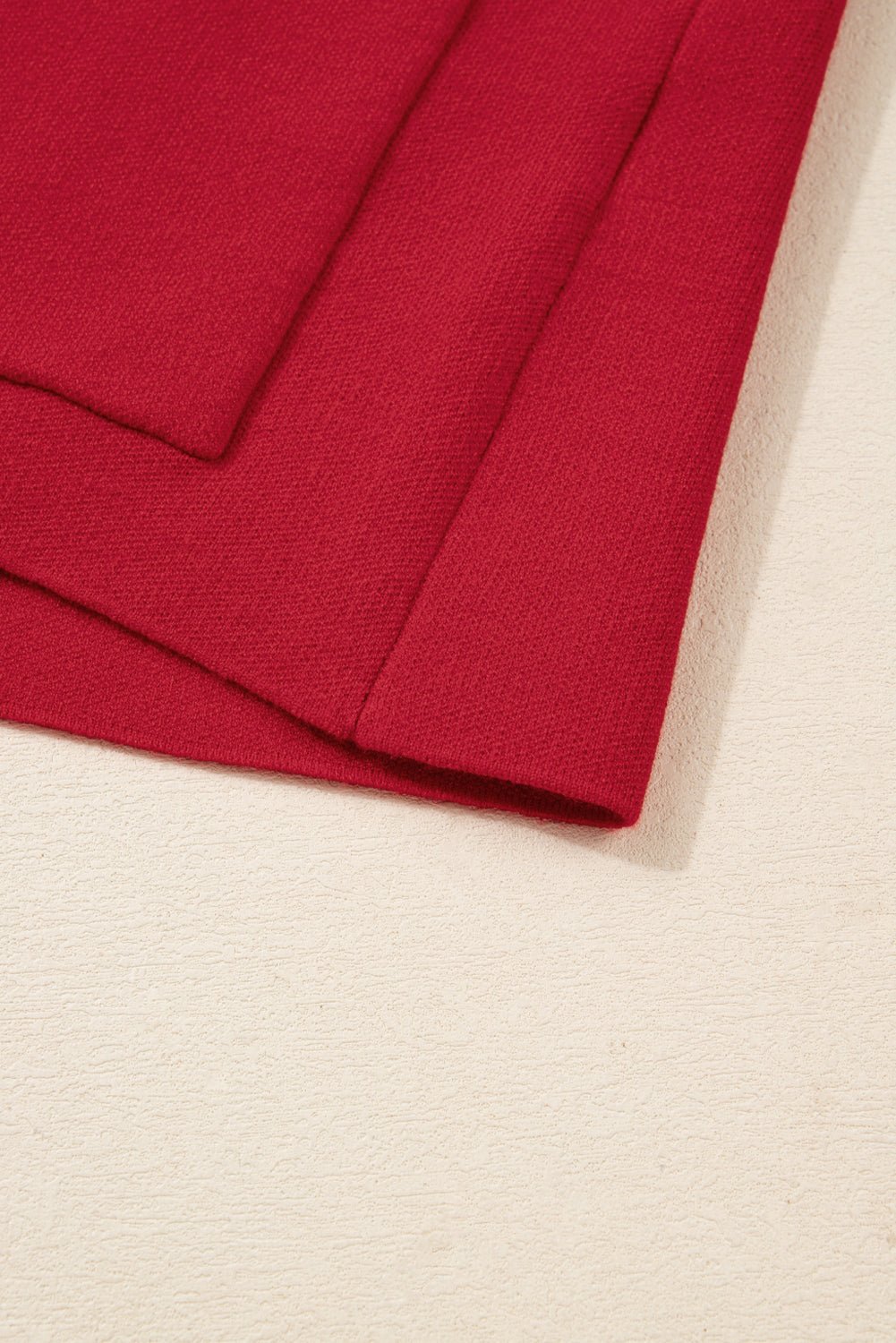 Red fabric on a beige background