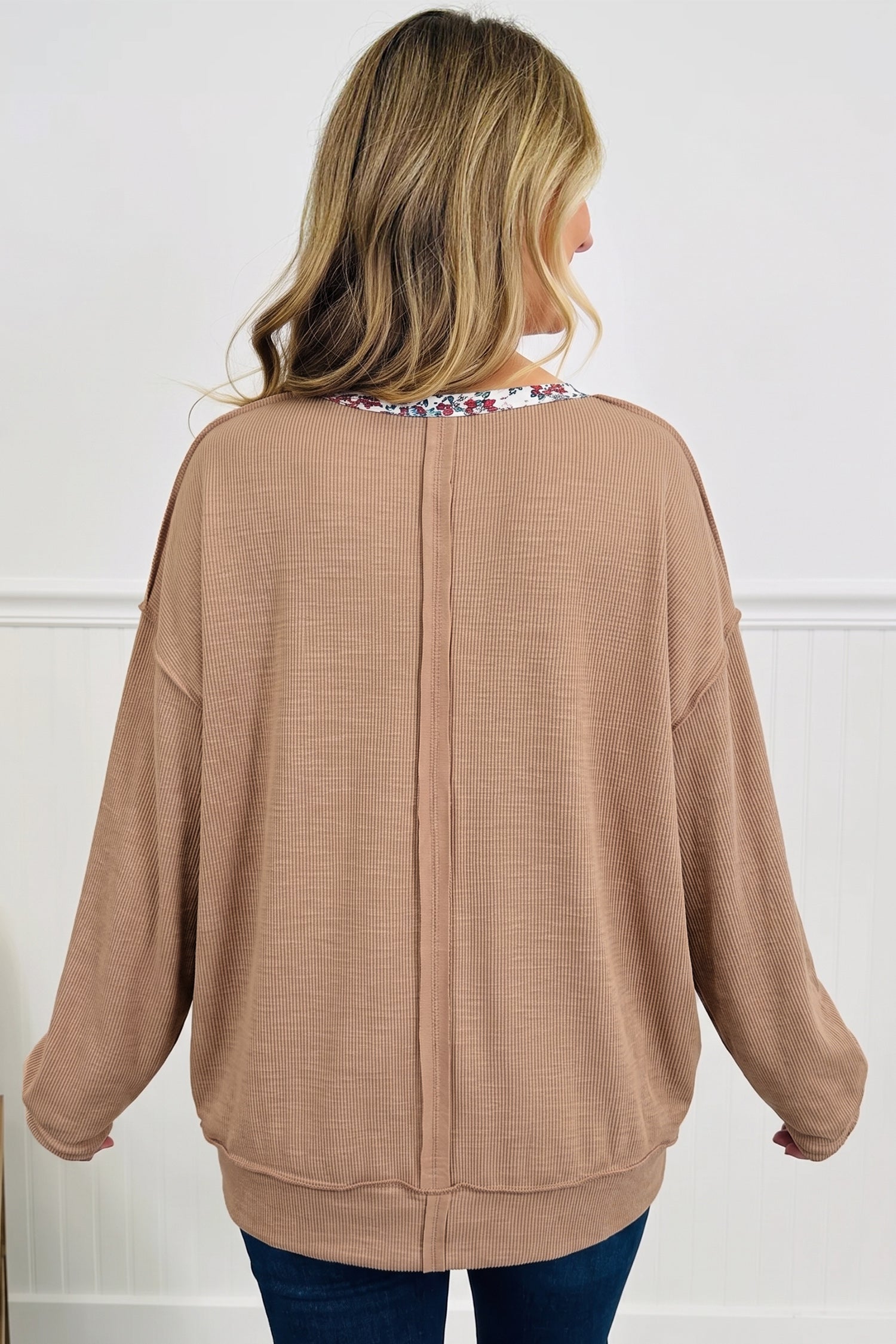 Beige ribbed tunic top with center back seam detail, back view