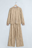 Khaki leopard print top and pants set on a hanger, back view