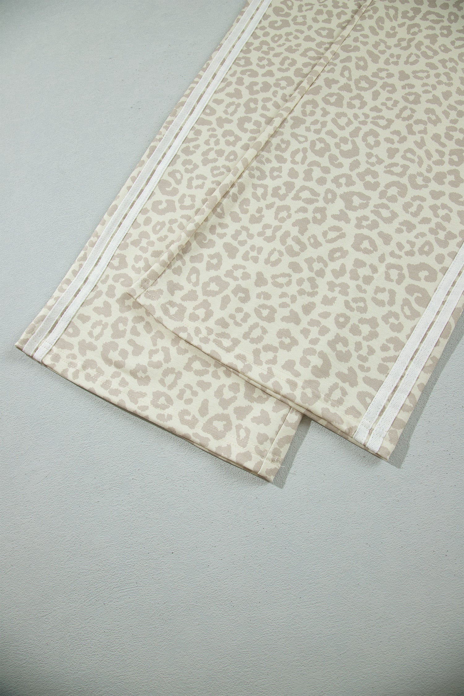 Apricot leopard wide leg pants hem with varsity stripes