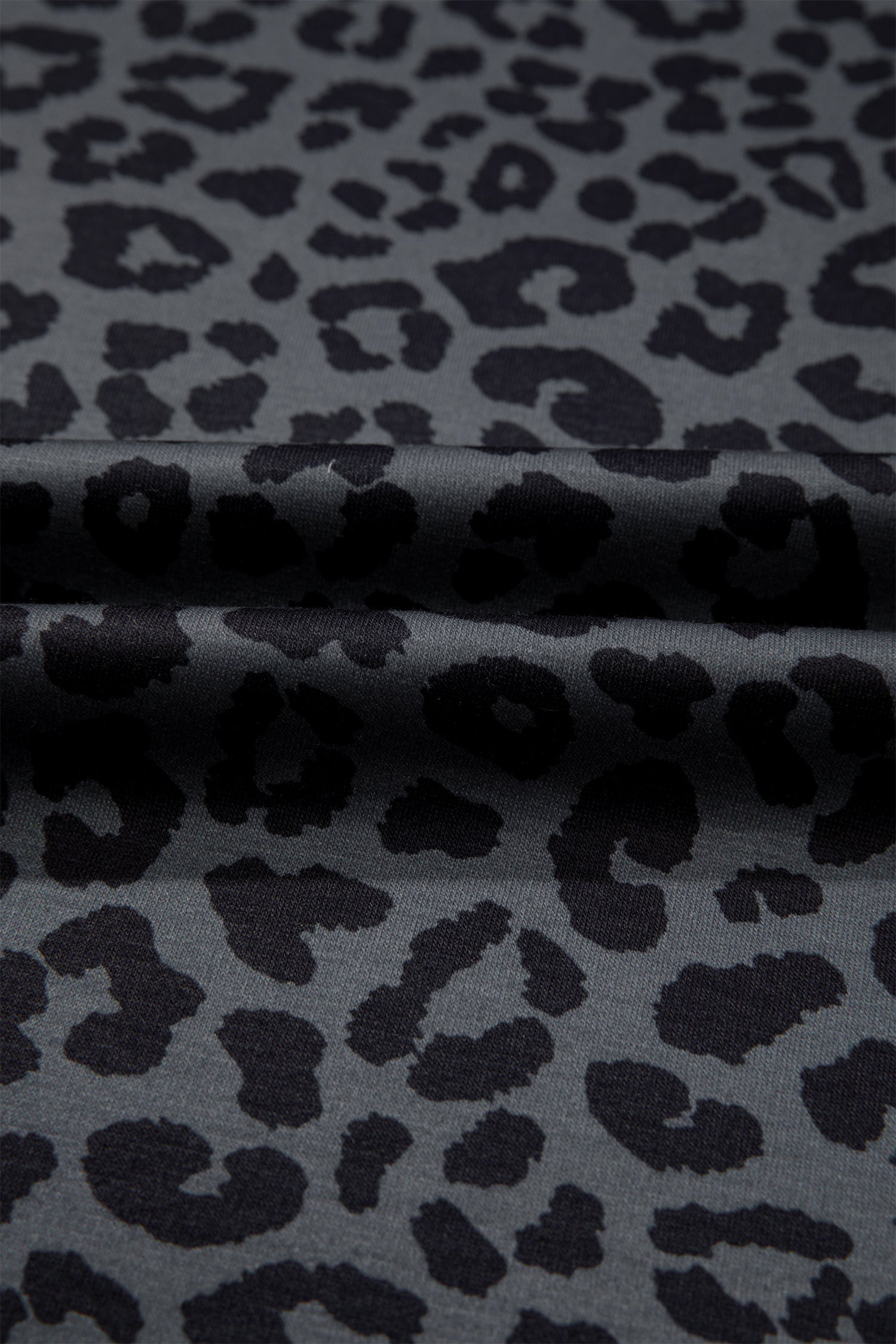 Gray leopard print fabric texture close-up