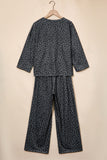 Gray leopard print top and pants set on a hanger, back view