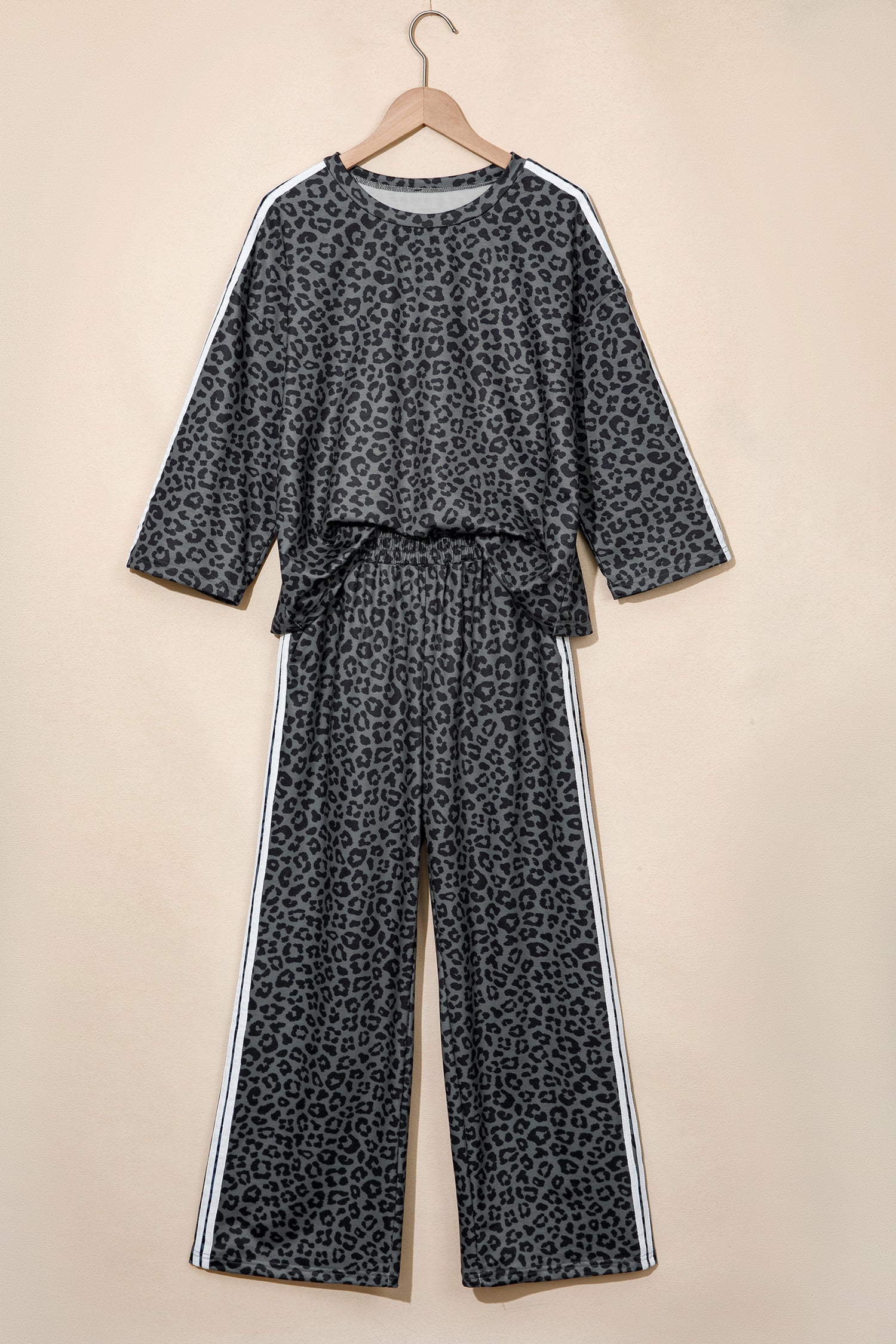 Gray leopard varsity stripe top and pants set on a hanger, front view