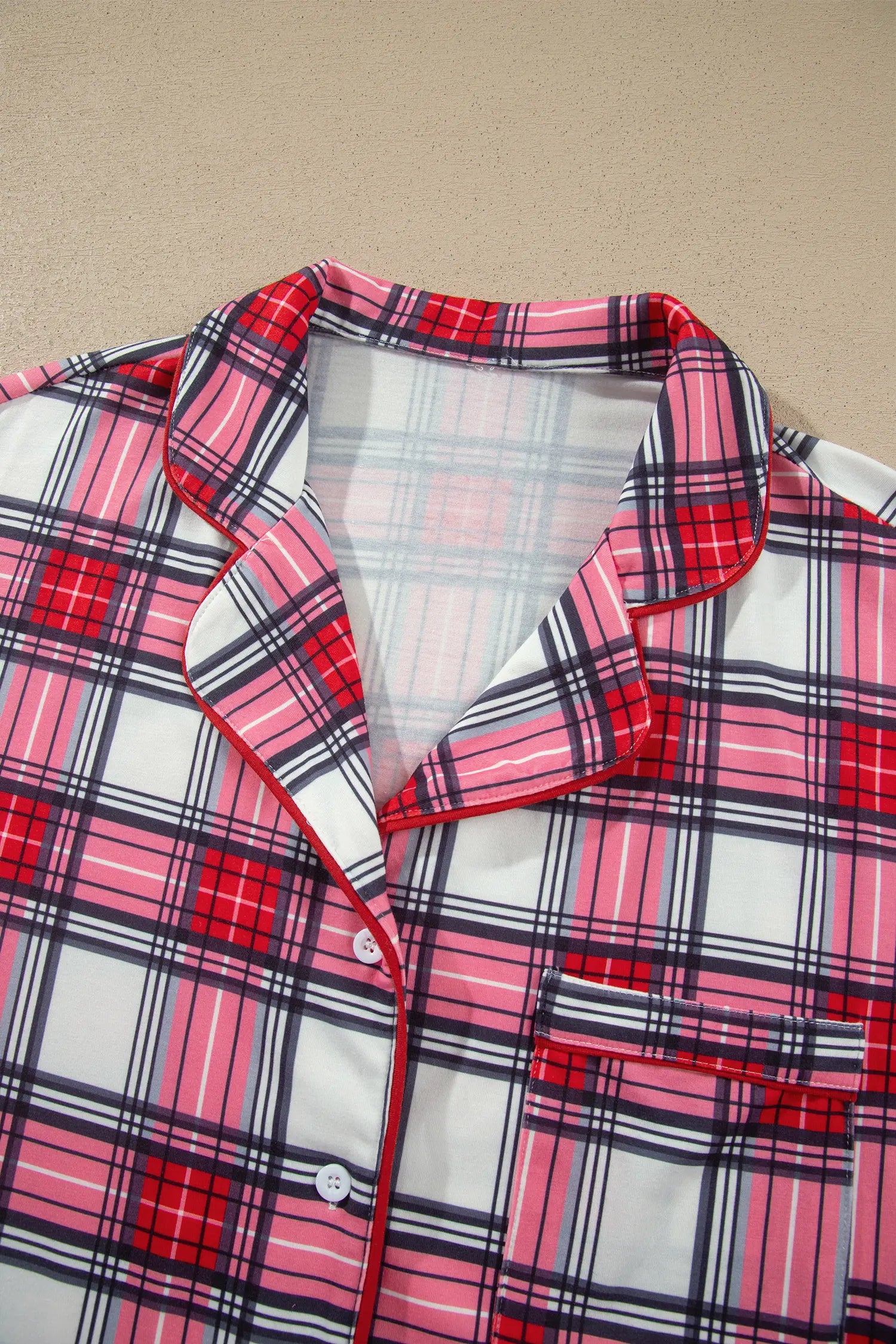 Red plaid pajama top collar and button front detail