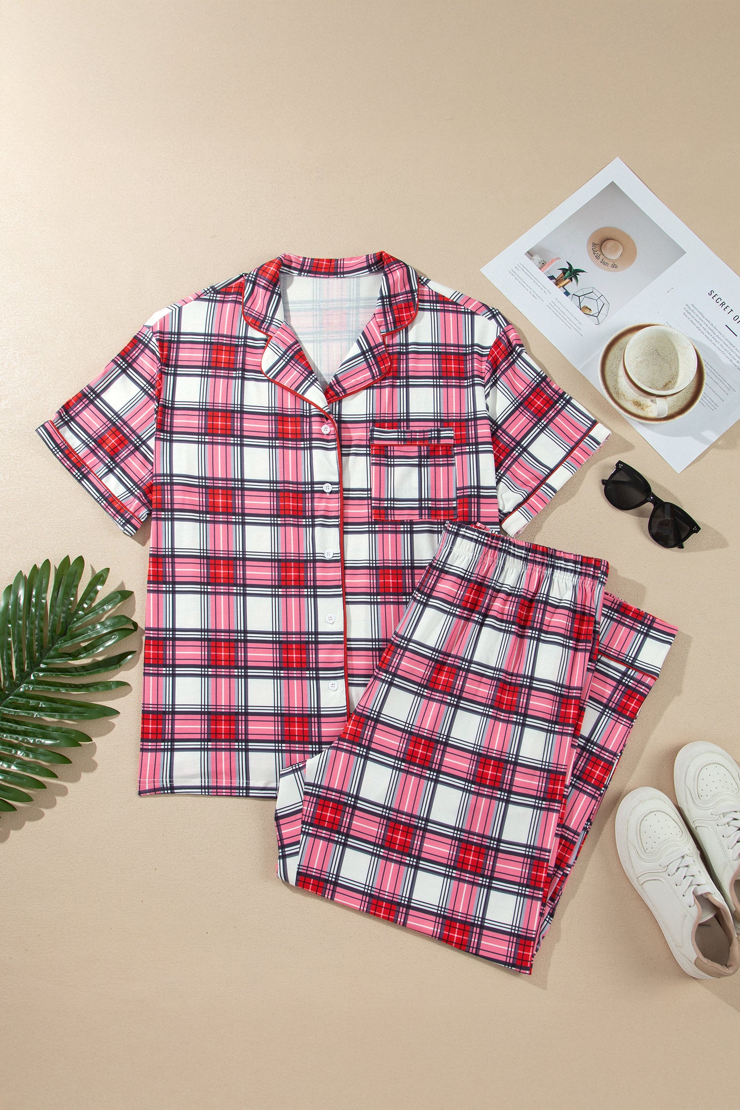 Red plaid short sleeve pajama top and pants set, flat lay
