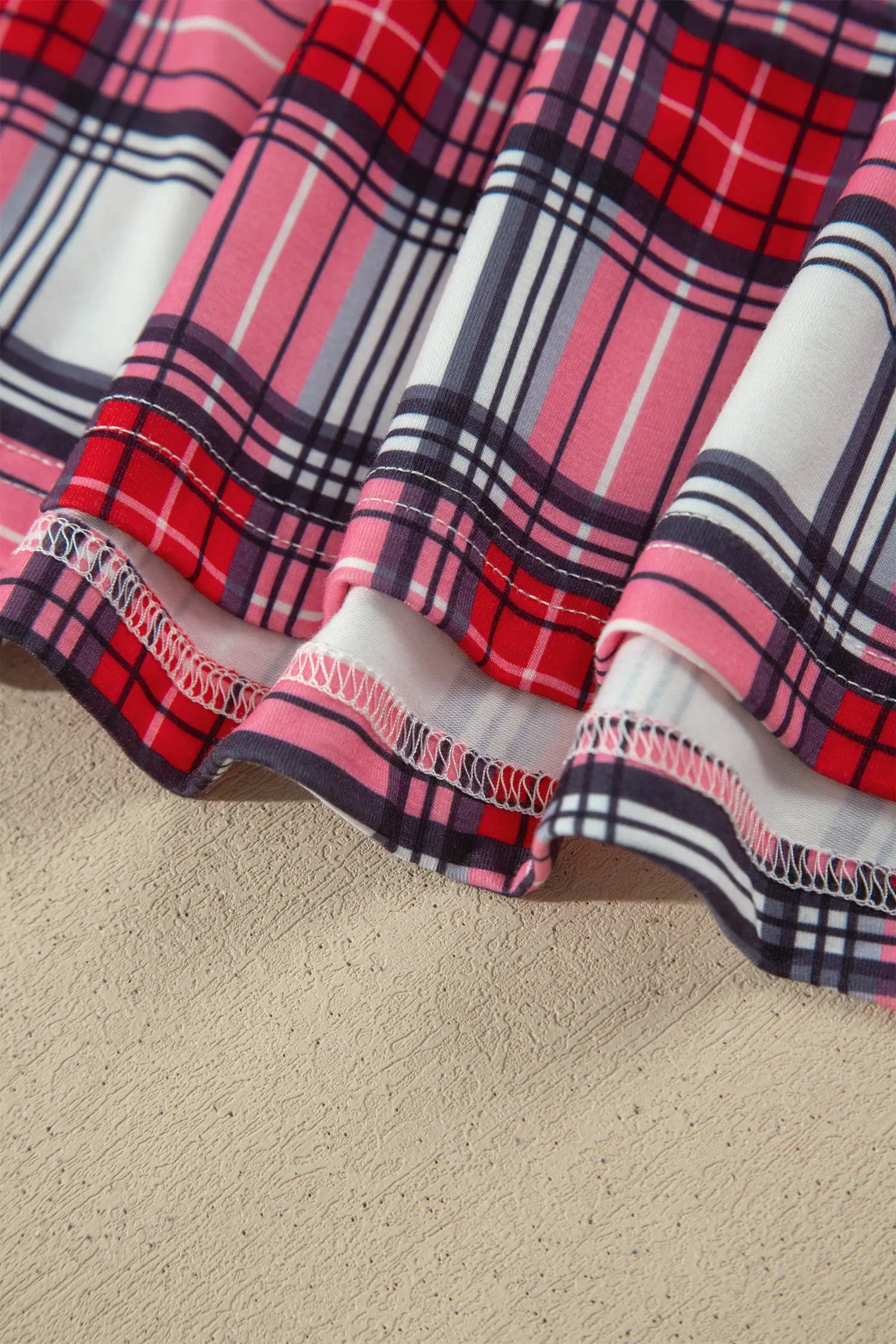 Red plaid pajama top hem detail