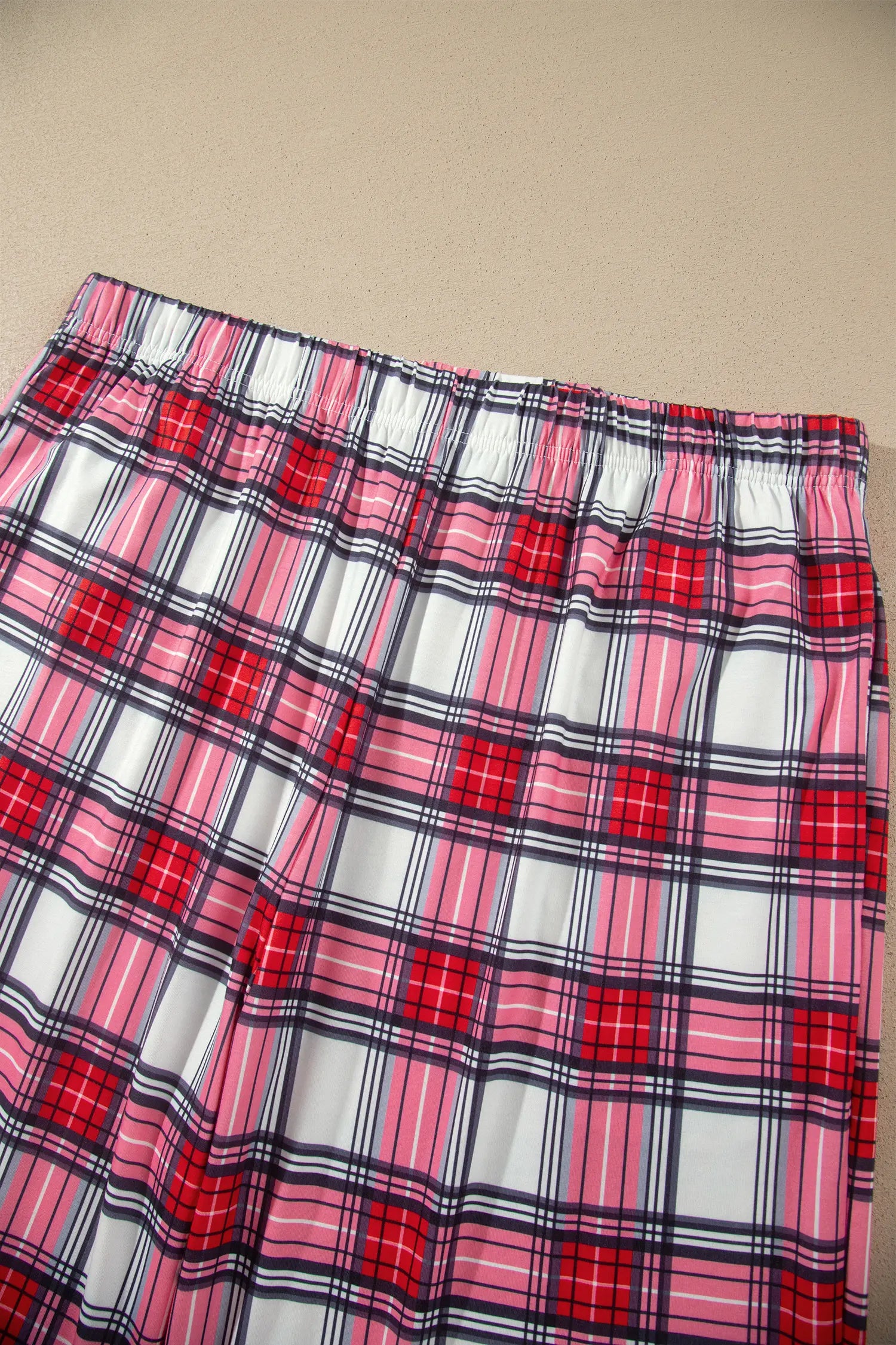 Red plaid pajama pants with elastic waistband