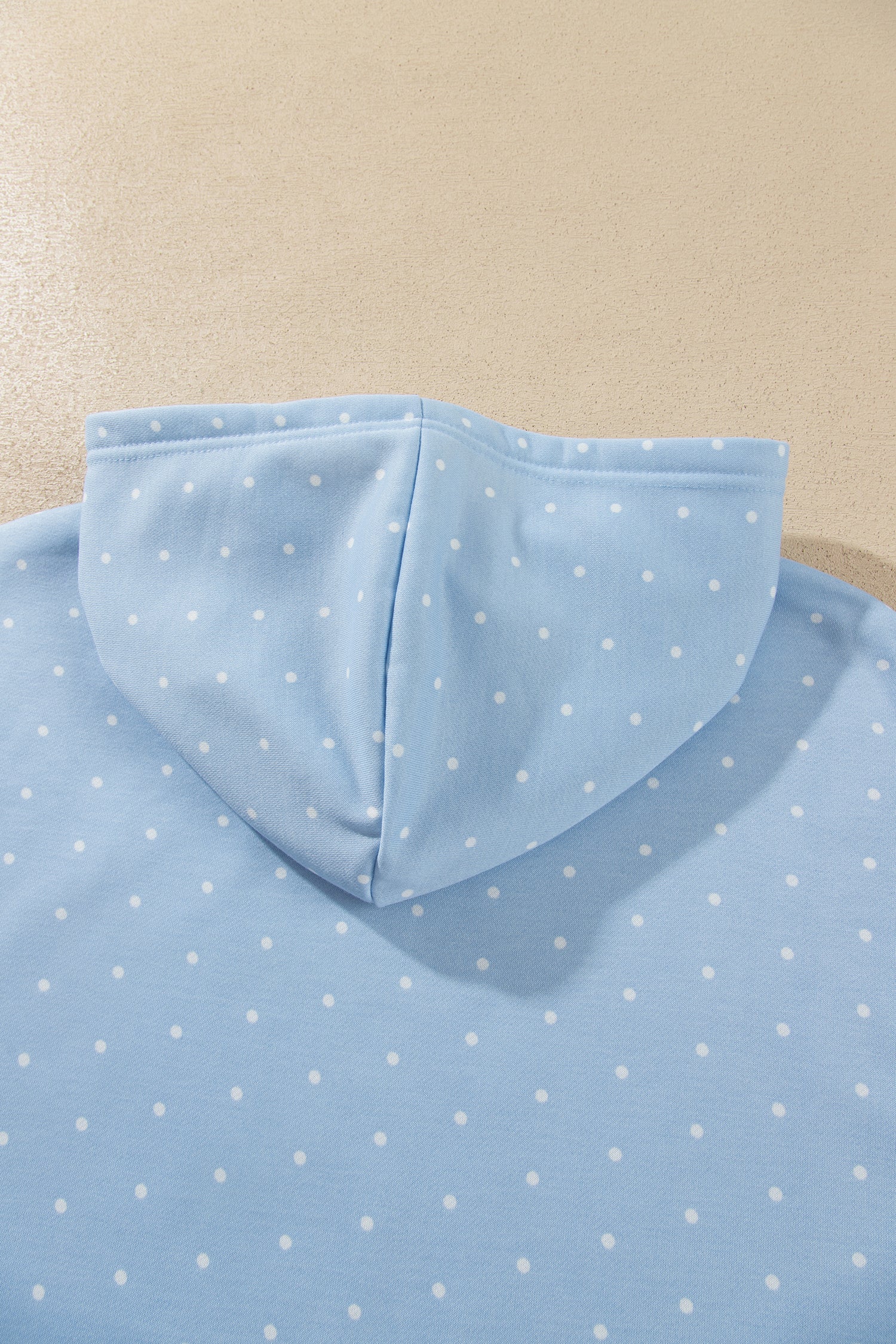 Sky blue polka dot hoodie hood, back view