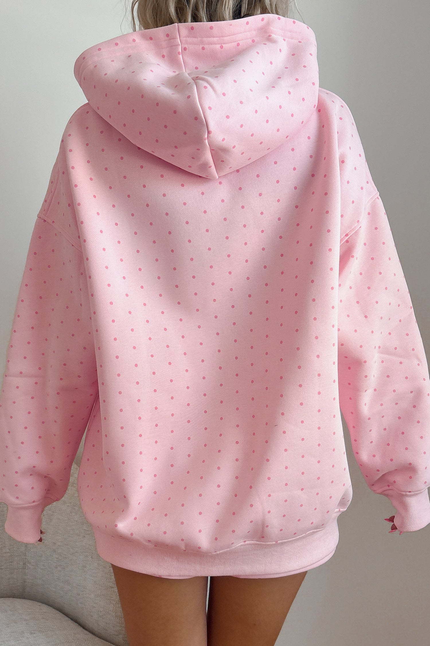 Women's pink polka dot oversized hoodie, back view