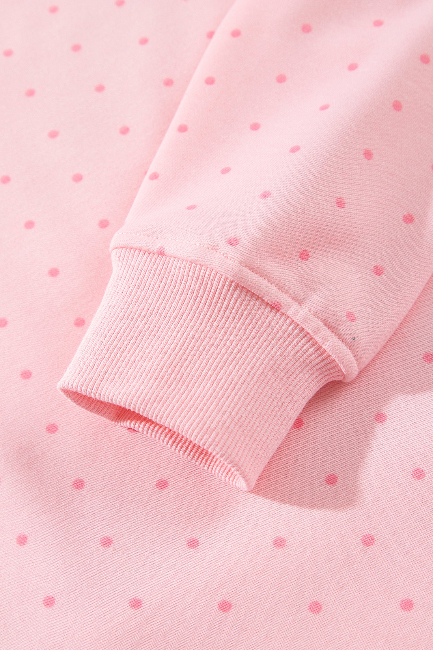 Pink polka dot hoodie ribbed cuff detail