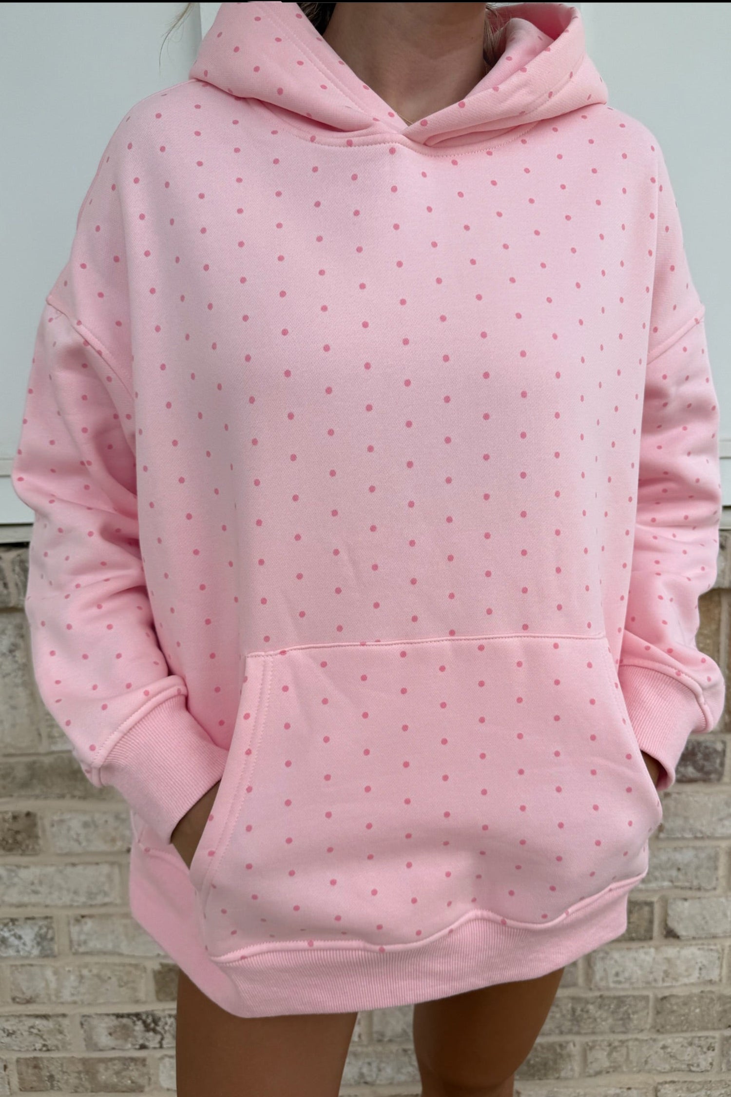 Pink polka dot hoodie with kangaroo pocket and matching shorts