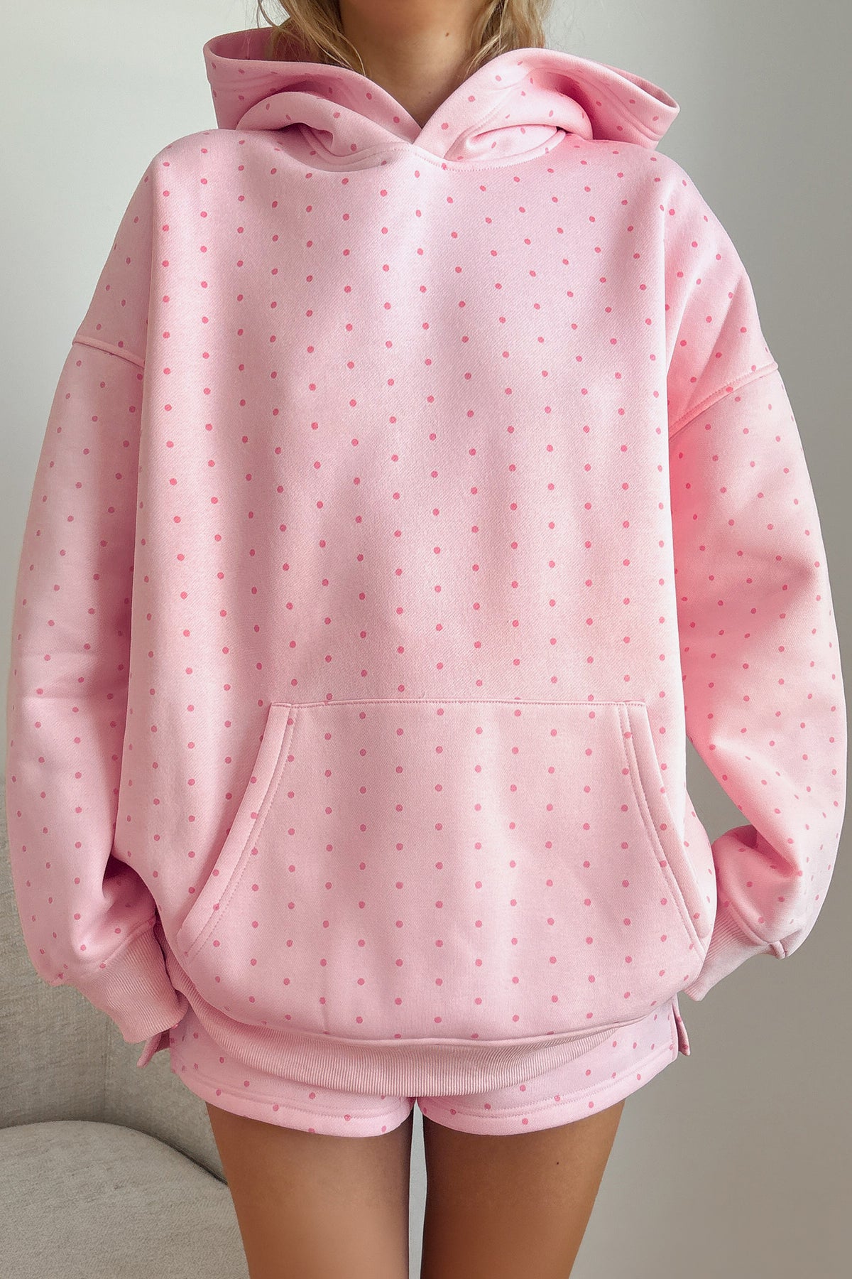 Women's pink polka dot oversized hoodie and shorts set, front view