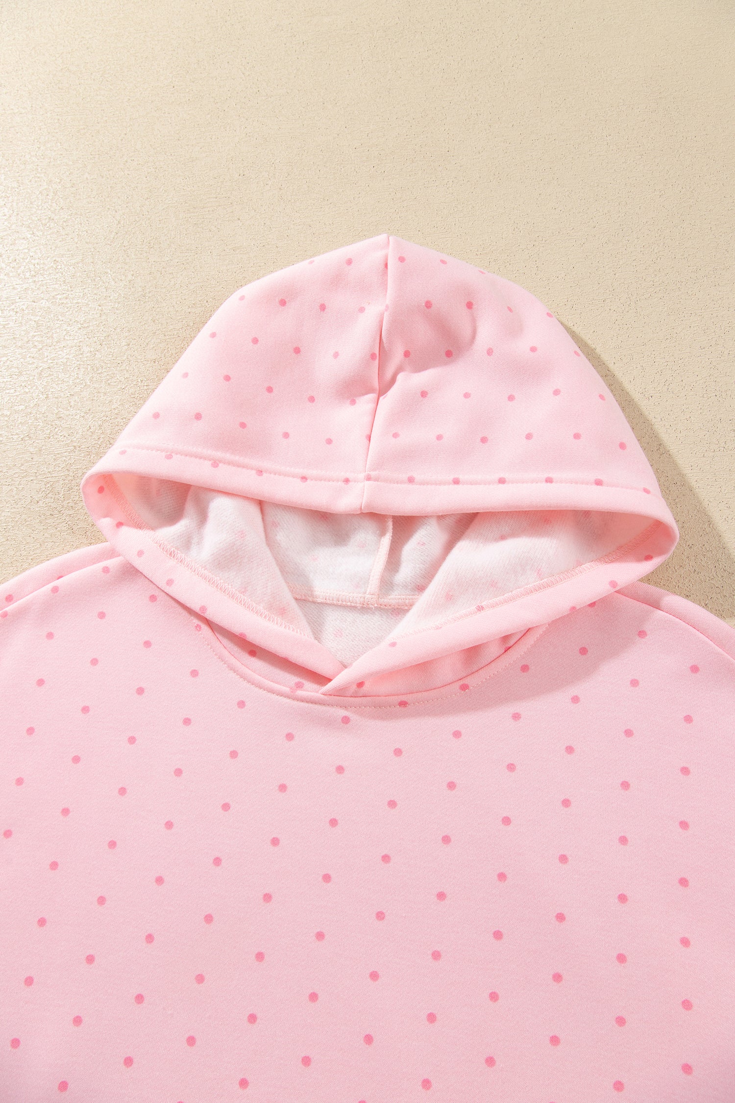 Pink polka dot hoodie lined hood detail