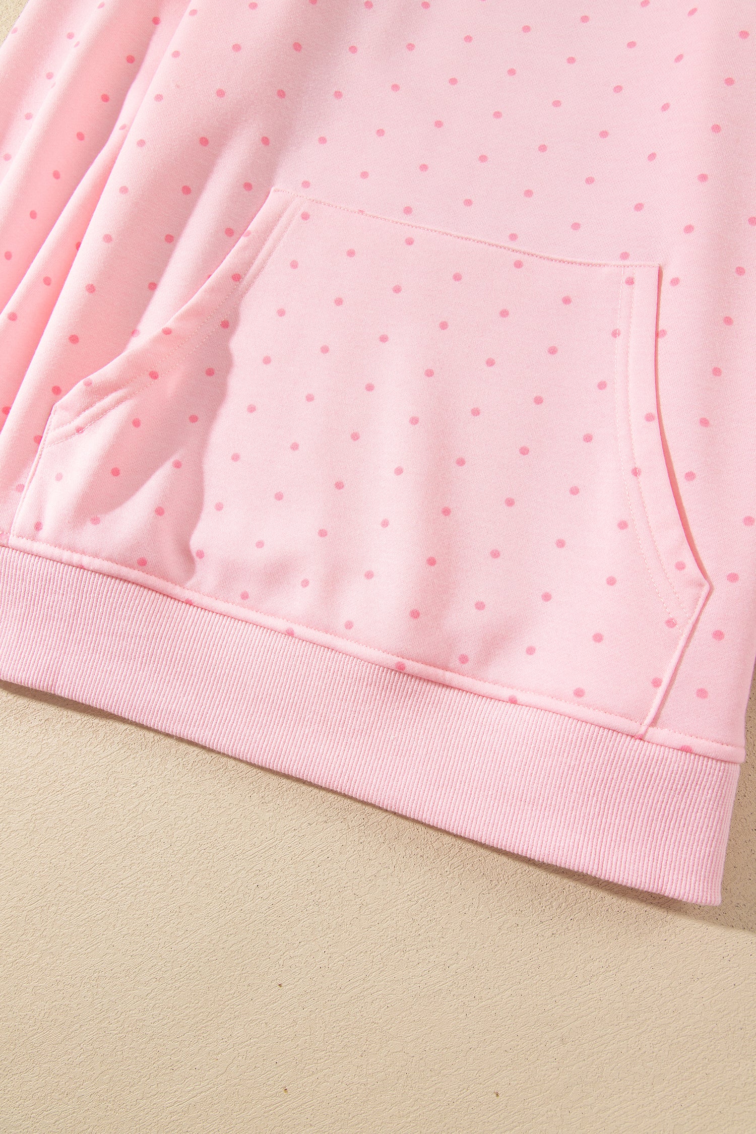 Pink polka dot hoodie kangaroo pocket and ribbed hem