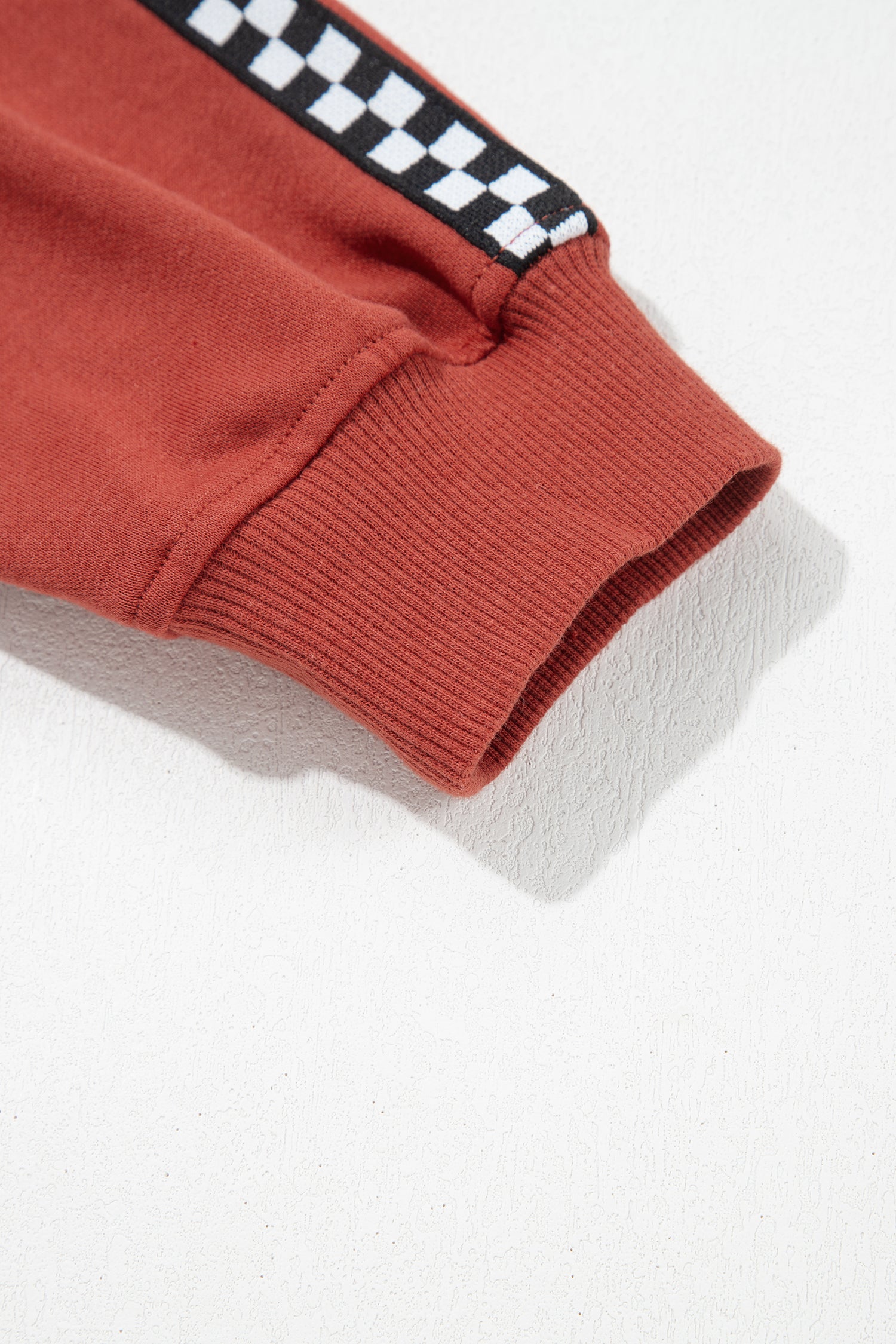 Mineral red sweatshirt cuff with checkered trim