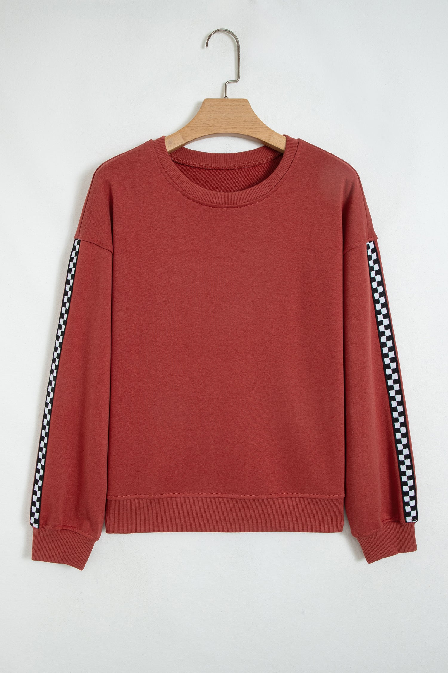 Mineral red checkered trim sweatshirt on a hanger, front view