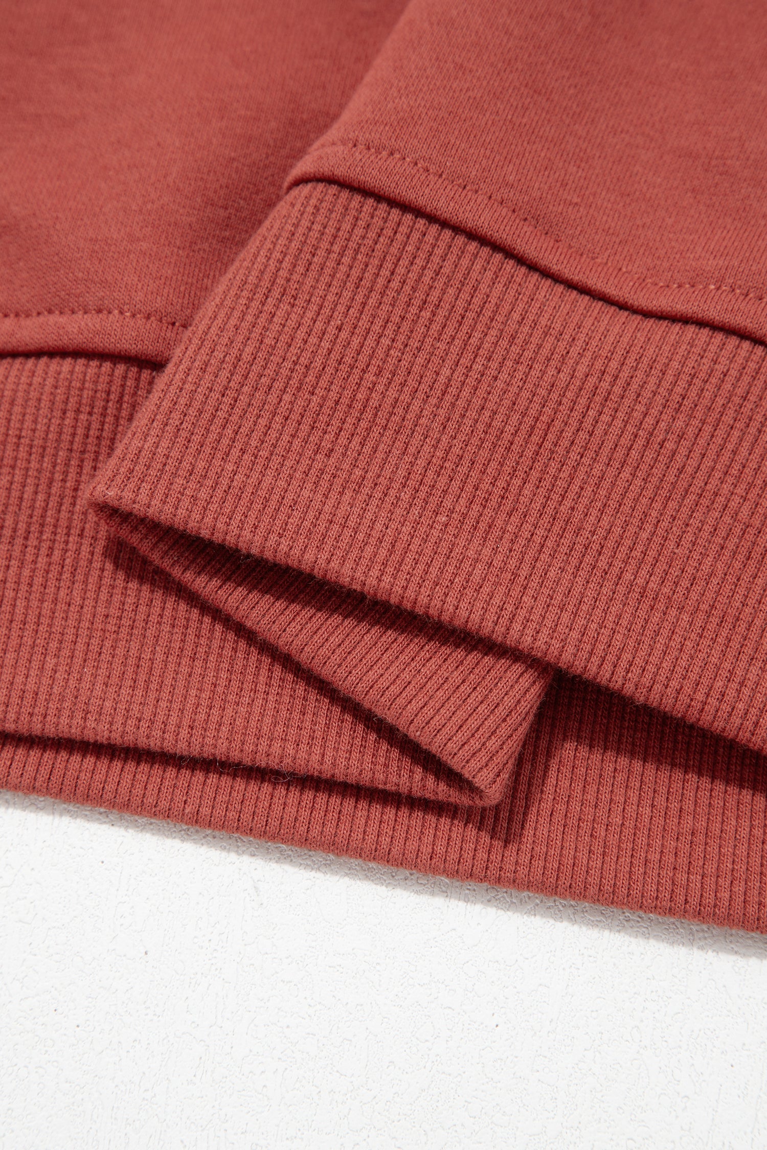 Mineral red sweatshirt ribbed hem detail