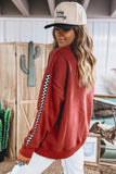 Red checkered sleeve sweatshirt with trucker cap, side back view