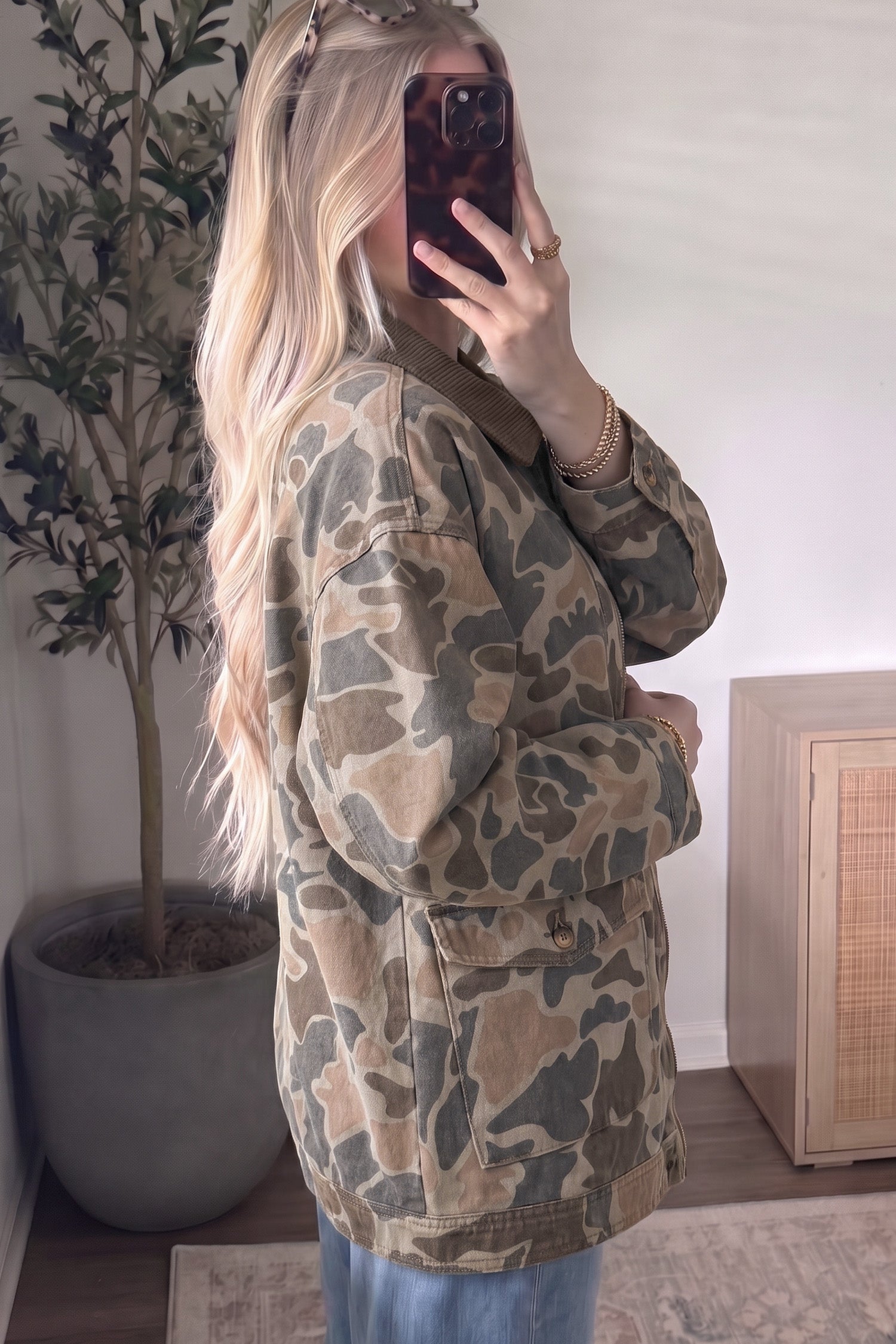 Women's oversized camo print jacket with flap pockets, side view