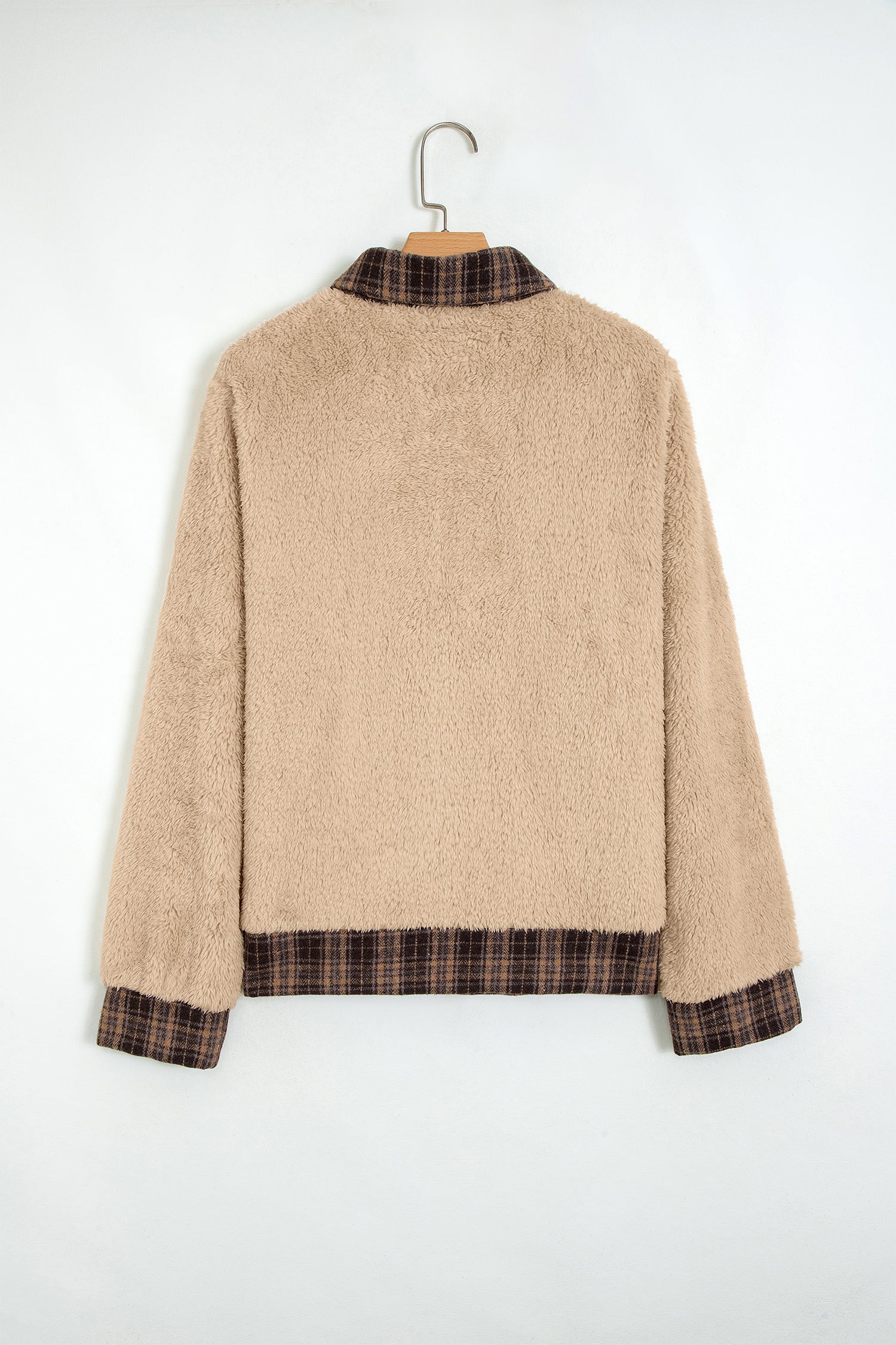 Beige sherpa fleece pullover with plaid trim on a hanger, back view