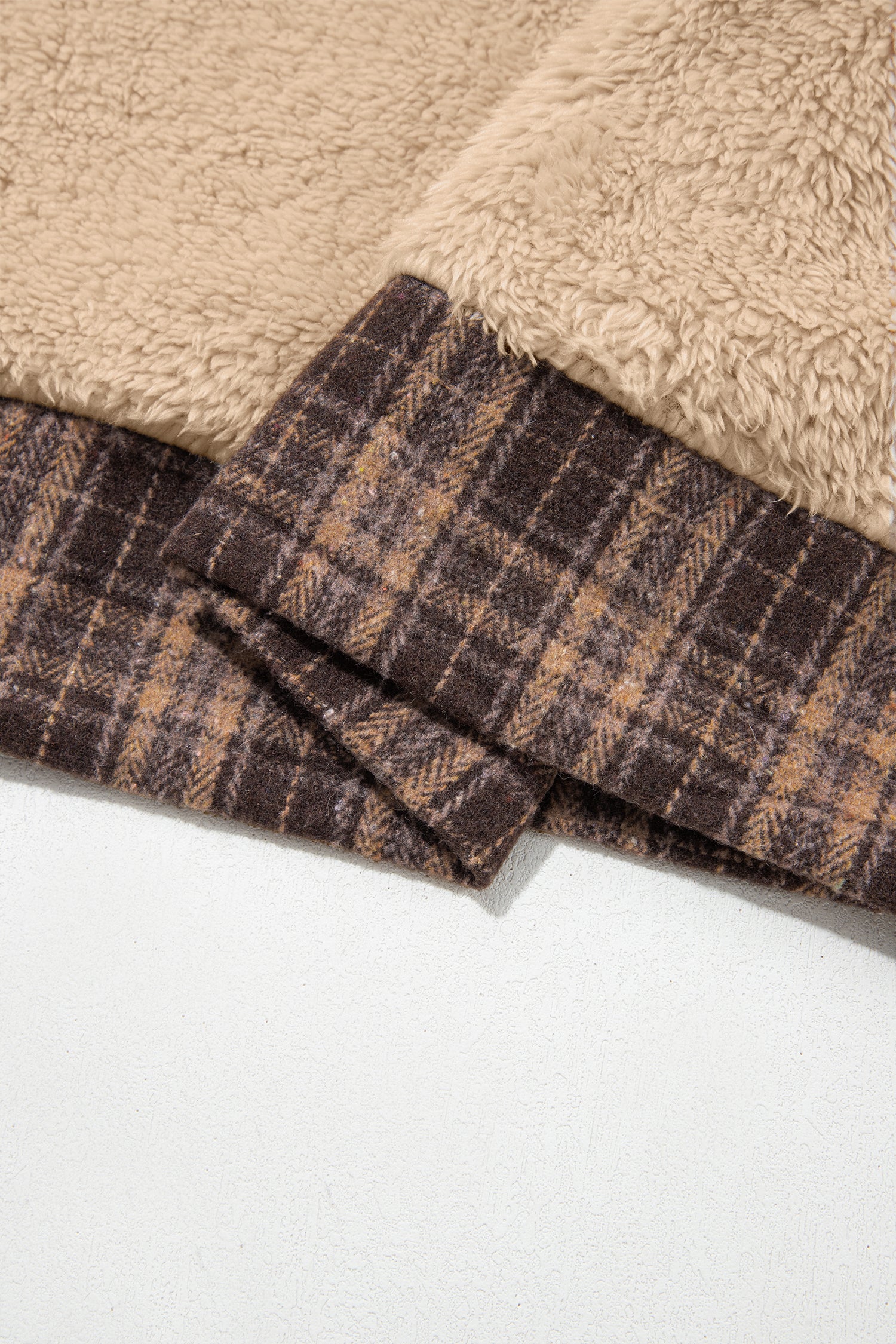 Beige sherpa fleece with brown plaid hem band detail