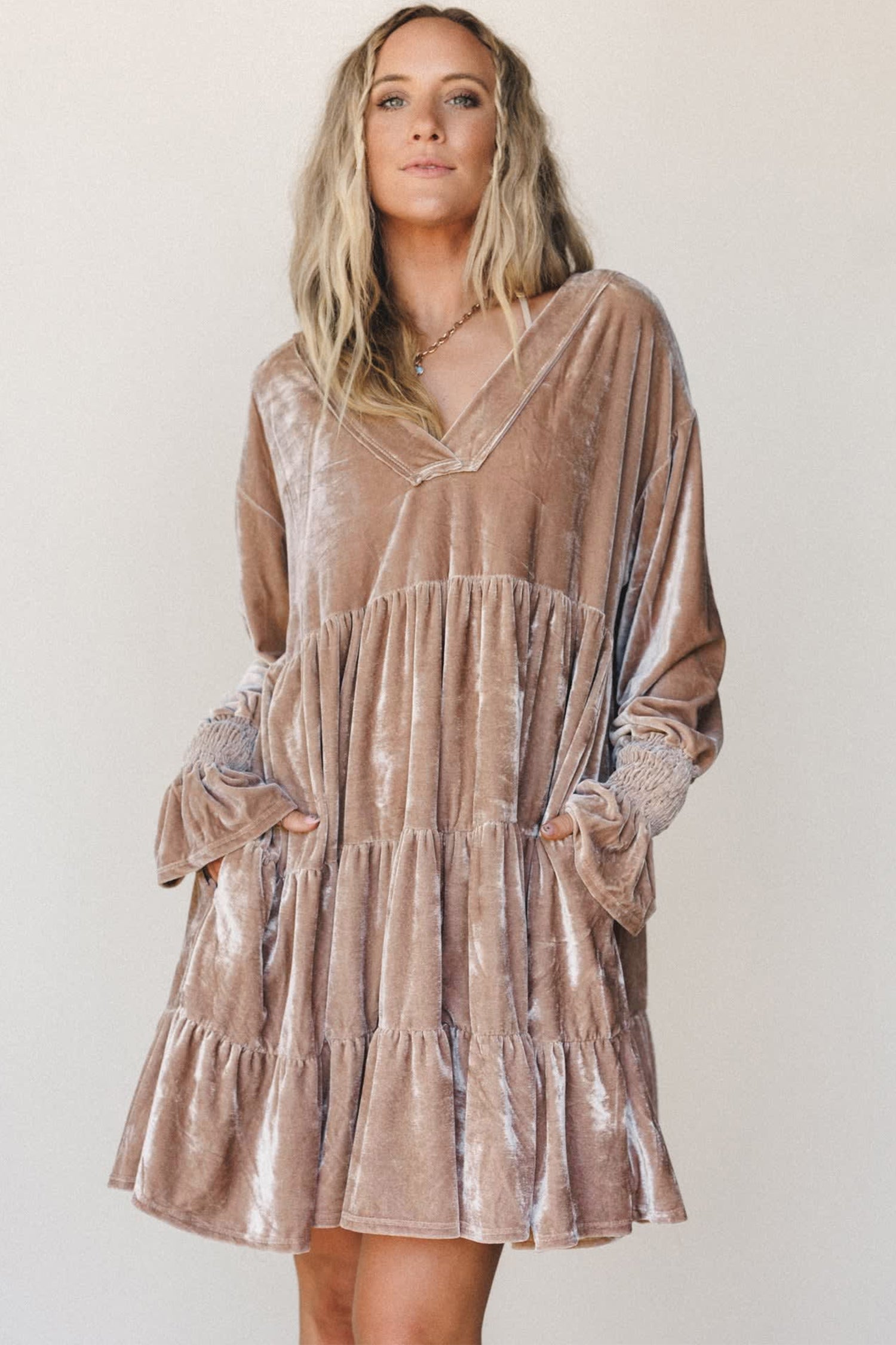 Women's velvet V neck tiered mini dress with hands in pockets