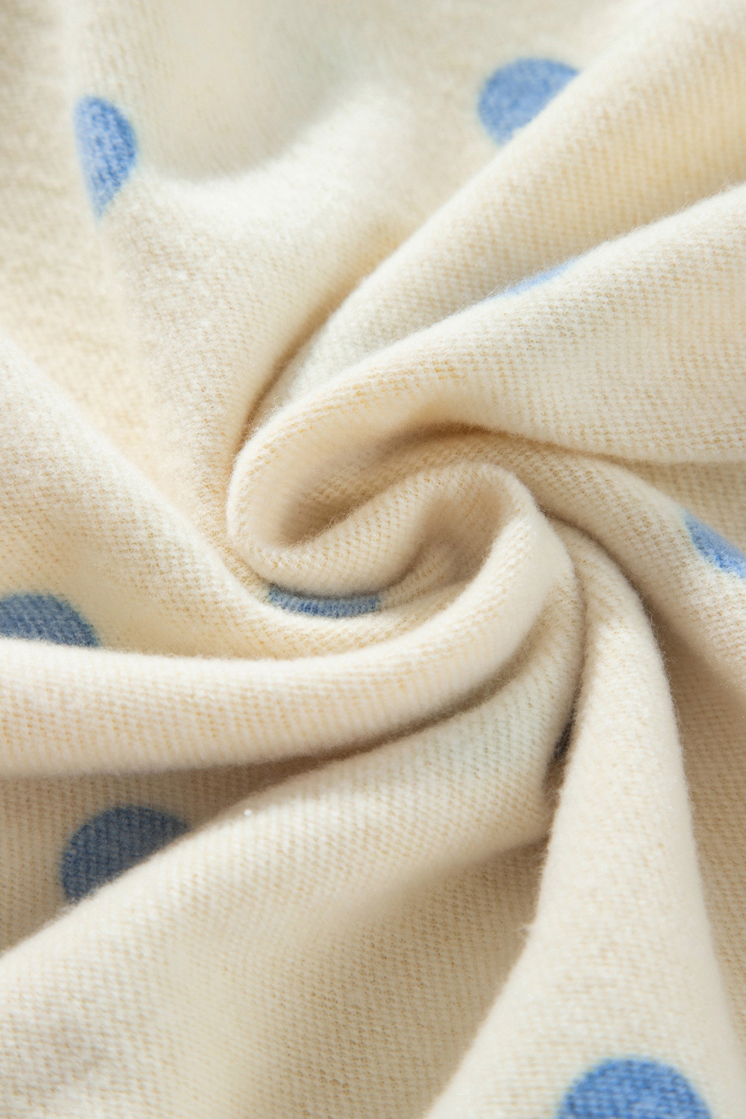Soft inner fabric of yellow polka dot lounge set, close-up