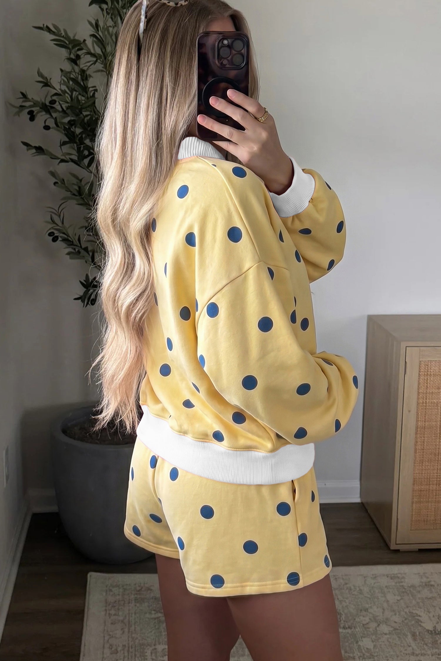 Yellow polka dot lounge set, side view on model